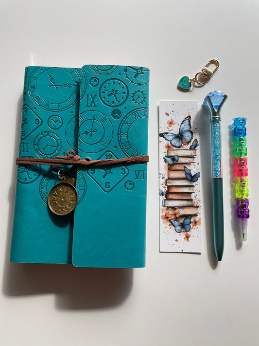 Aesthetic teal A6 bookish journal set featuring embossed vintage clock notebook, crystal pen and heart keychain